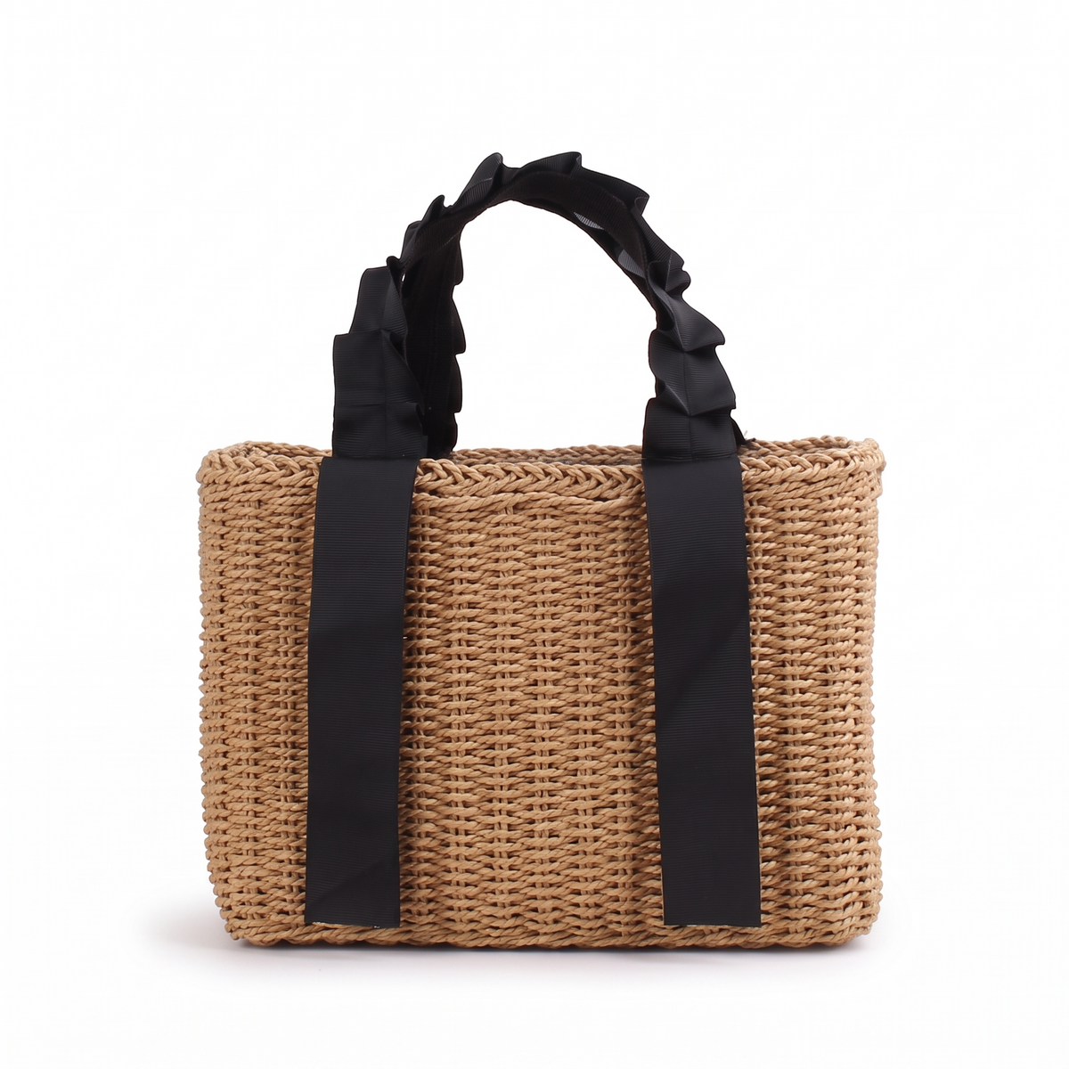 Sac à main d'été en paille tressée sur fond blanc